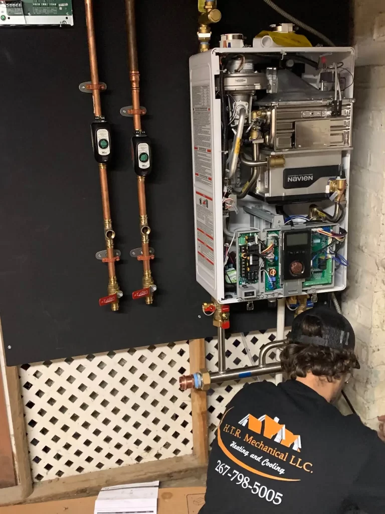 H.T.R. Mechanical Boiler Repair Specialist Fixing a Residential Boiler